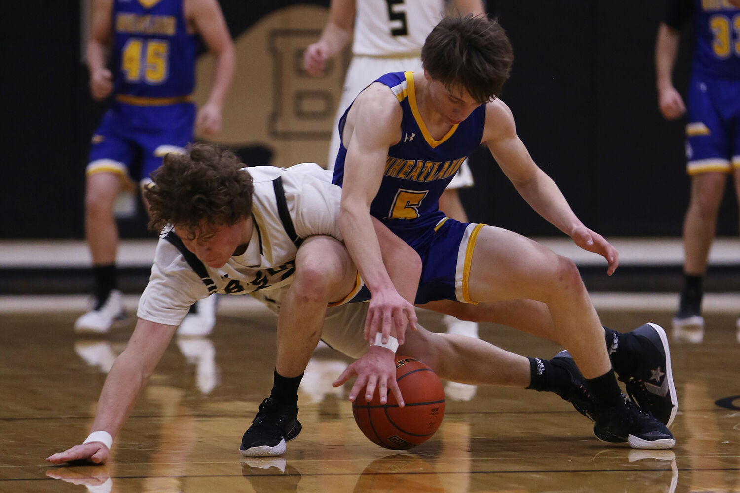 Calvin Rule dives to steal the ball away from Wheatland junior Rodee Brow